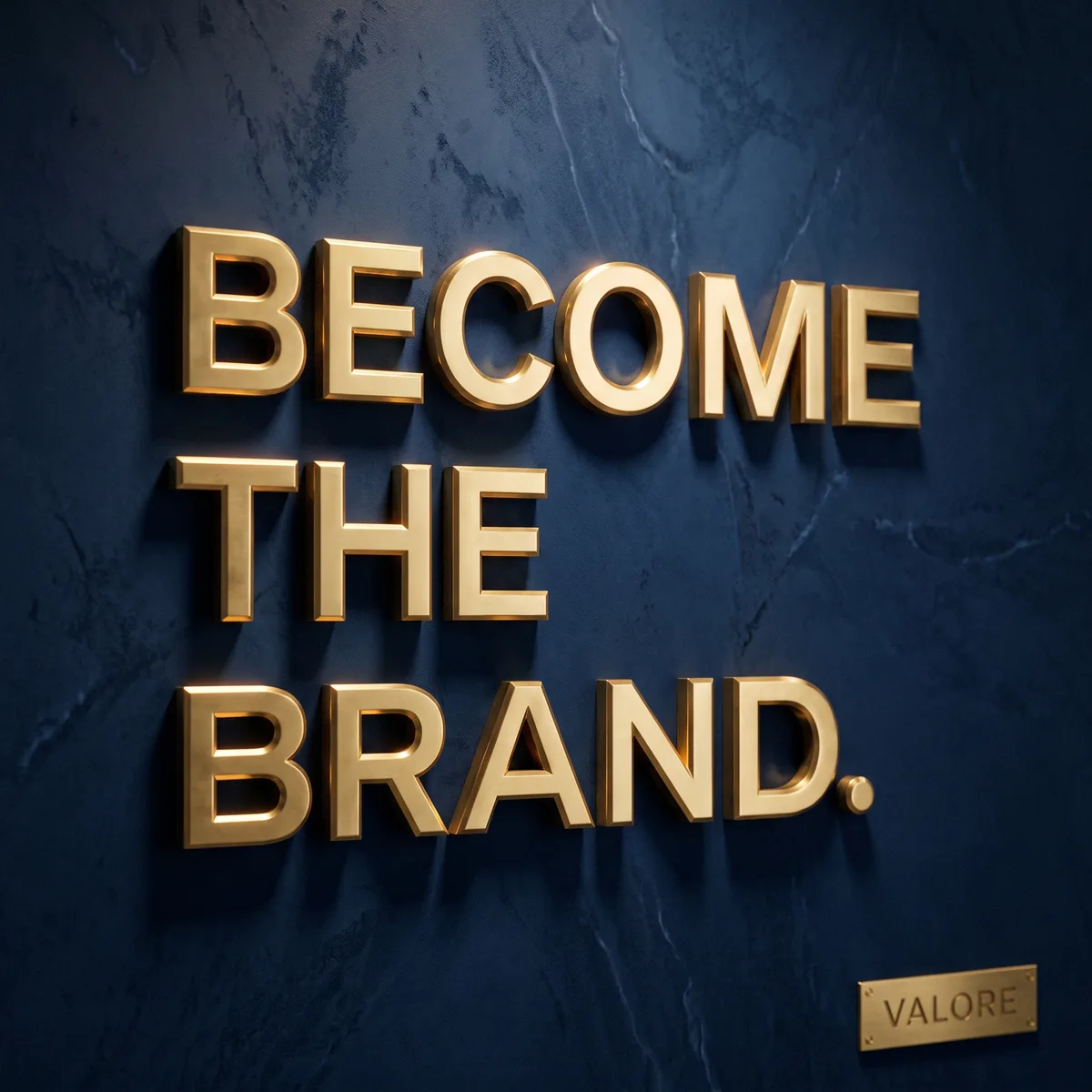 Brass letters on a navy marble wall reading Become The Brand, by Valore