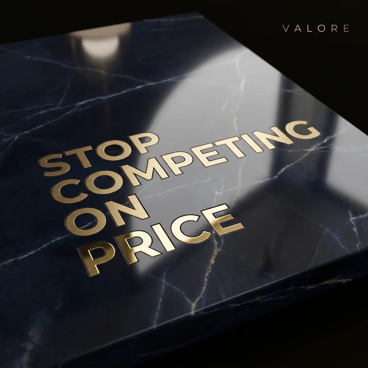 Gold lettering on a navy marble slab reading Stop Competing On Price, by Valore